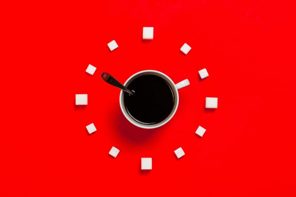 Coffee cup and sugar cubes as a clock